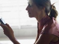 Female Student Using Her Cell Phone