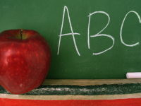 Apple in Front of Chalkboard