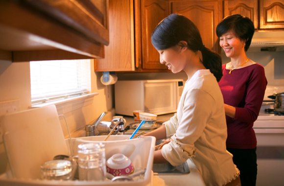 Female College Student at Home With Her Mother