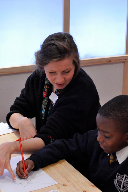 Volunteer Helping Student