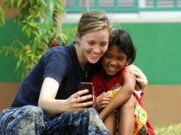 Volunteer Posing with Child