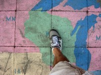 Person Stepping on Chalk Map